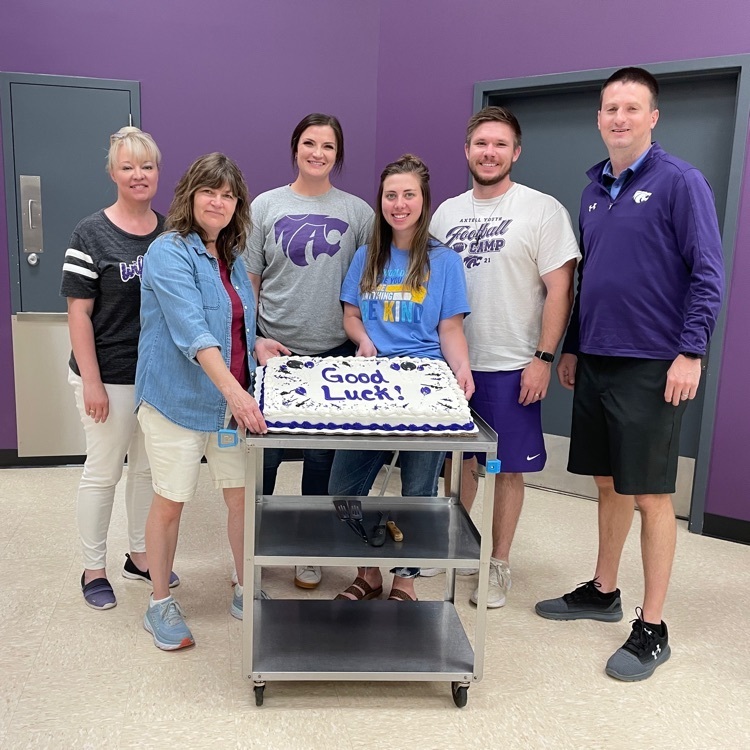 Jennifer March, Kristin Welsh, Rebecca McDowell, Jessica Coons, Ryan Ambrose and Jeff Schwartz stand next to a big cake that says good luck